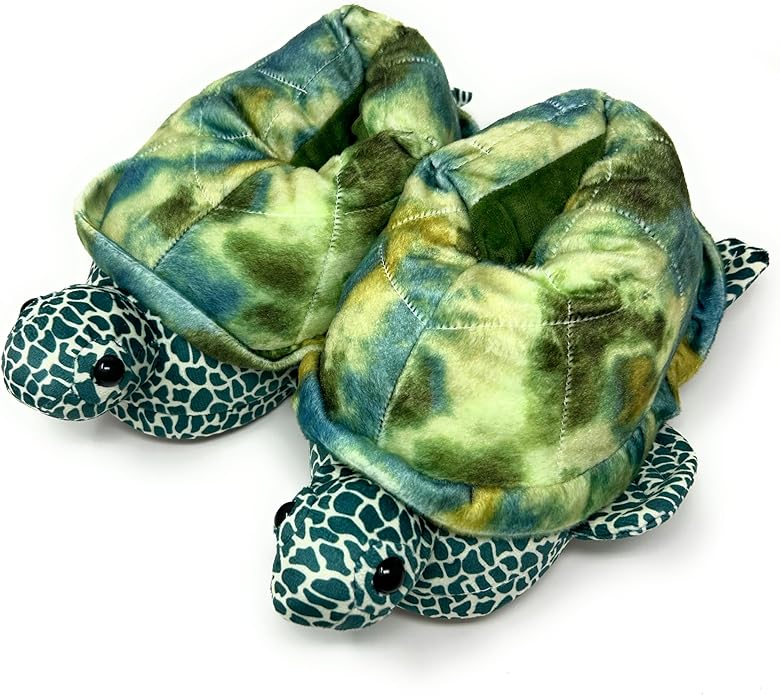 Plush turtle slipper with green and blue pattern on a white background